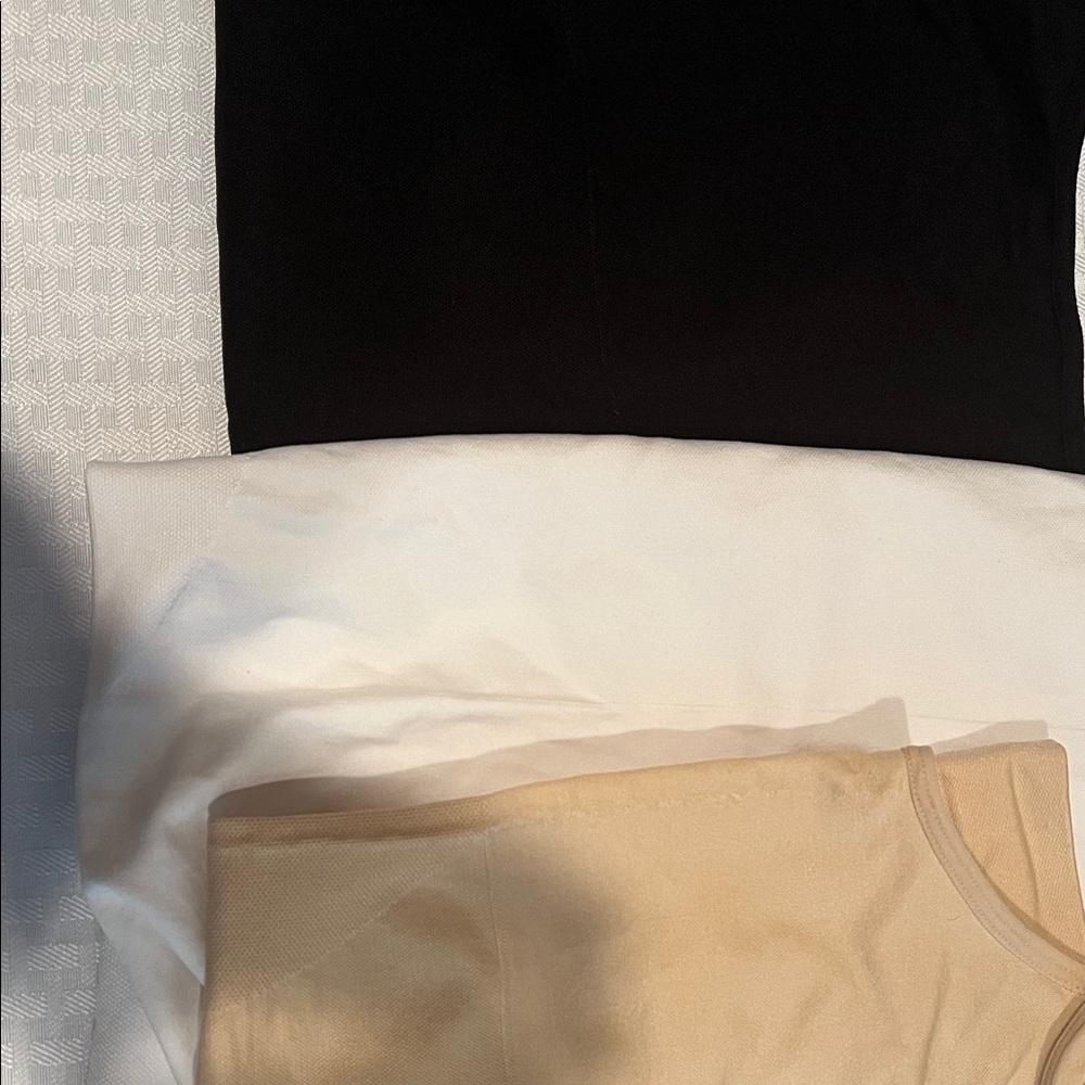 Black, White, and Tan shape wear tank tops